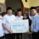 Bupati Sidoarjo Serahkan Santunan BPJS Ketenagakerjaan kepada Keluarga Kepala Desa Tropodo